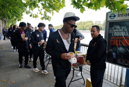 Players from the Arizona State collect burgers and fries before embarking on the boat trip.