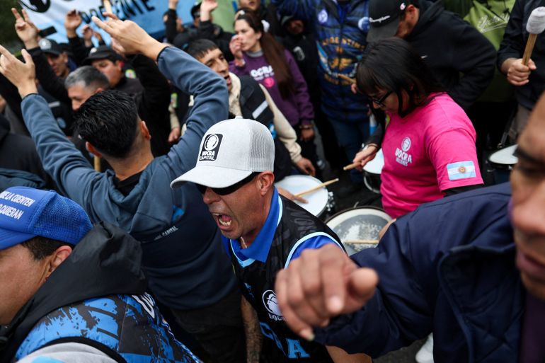 Workers, union members and social organization activists march toward Argentina's Economy Ministry during a protest against rising household debt levels, organisers say, in Buenos Aires, Argentina, August 20, 2026 [Antonio Becerra Pegoraro/Reuters]