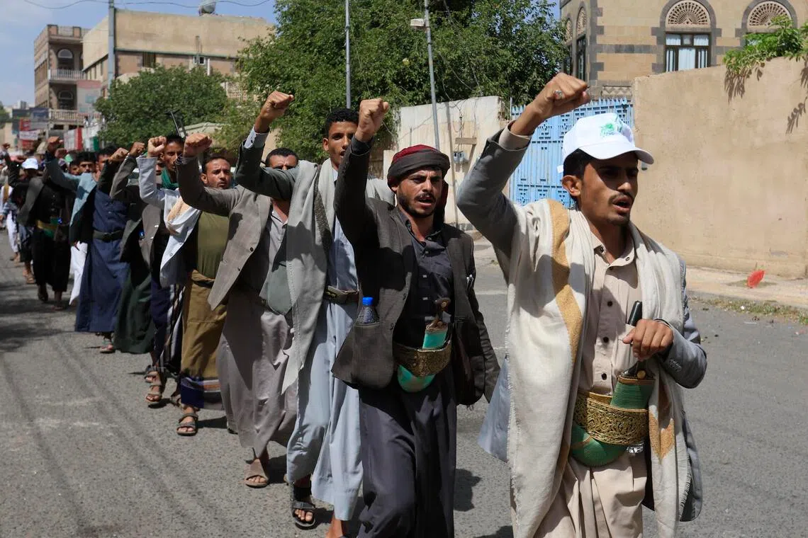 Houthi fighters march during a campaign to mobilise more fighters amid an offensive against Saudi-backed government troops, in Sana’a, Yemen, on Sept 10.