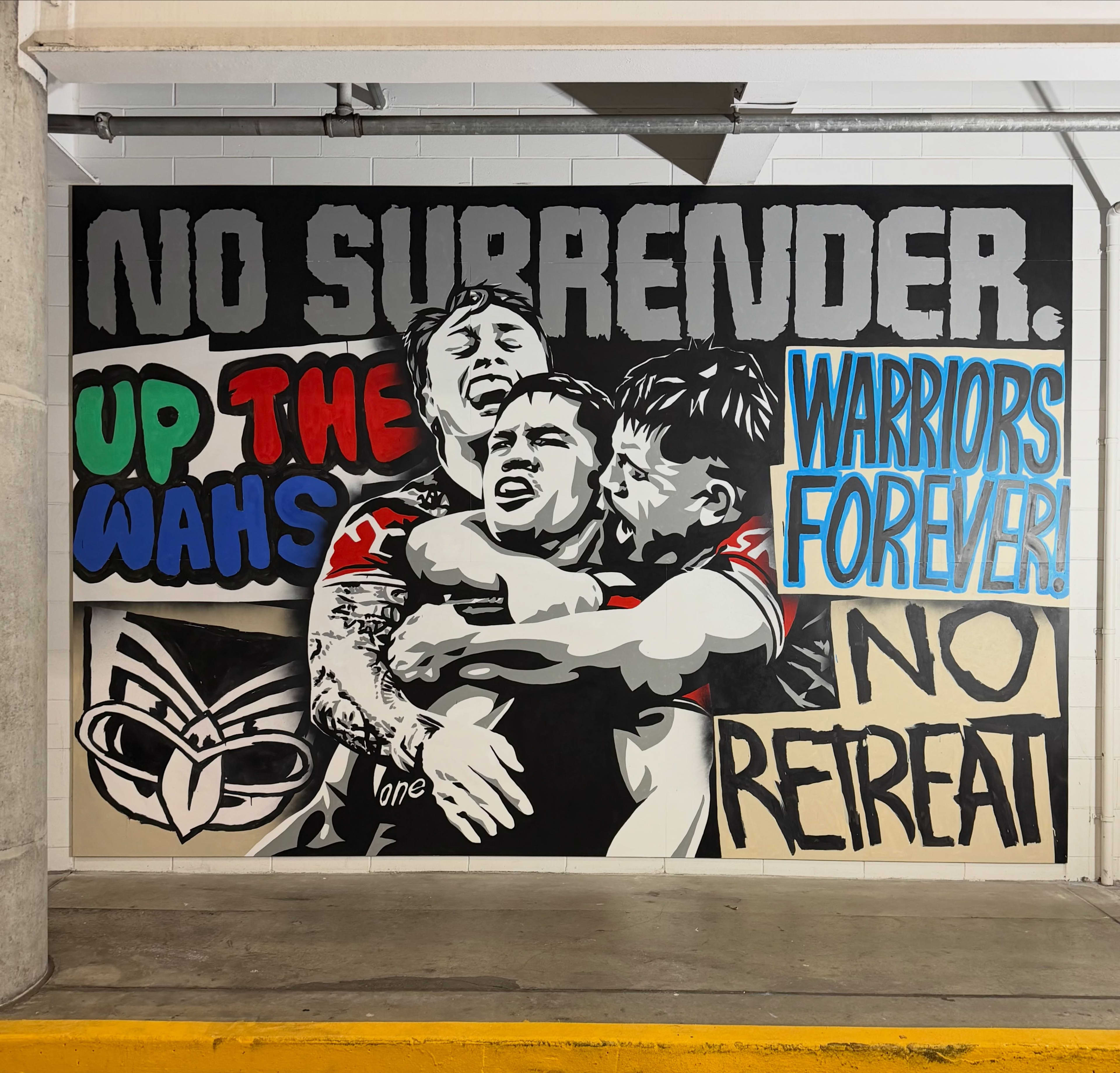 A mural by Otis Frizzell of three Warriors players embracing and fan signage surrounding them.