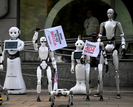 Humanoid robots hold protest signs and flags reading 'Error 404' during a demonstration in Warsaw last week