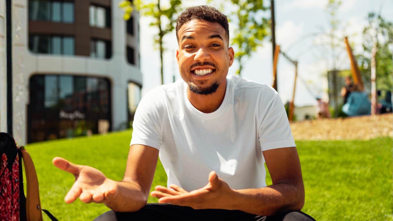 Man gestures animatedly mid-explanation, all confident energy and open hands, saying plenty at a glance.