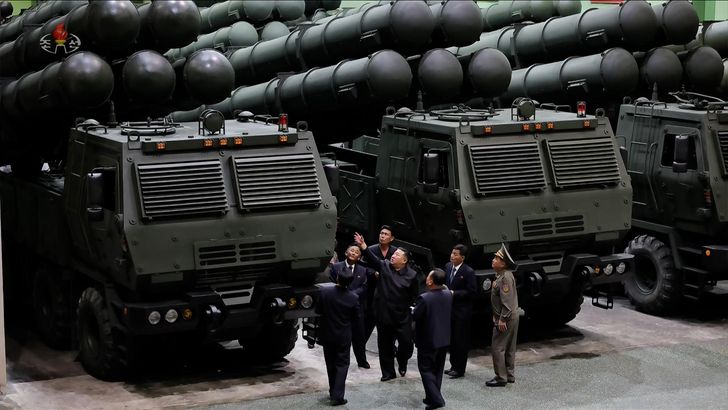 North Korean leader Kim Jong-un, center, inspects a munitions factory in this photo captured from North Korea's official Korean Central TV, Saturday. Yonhap