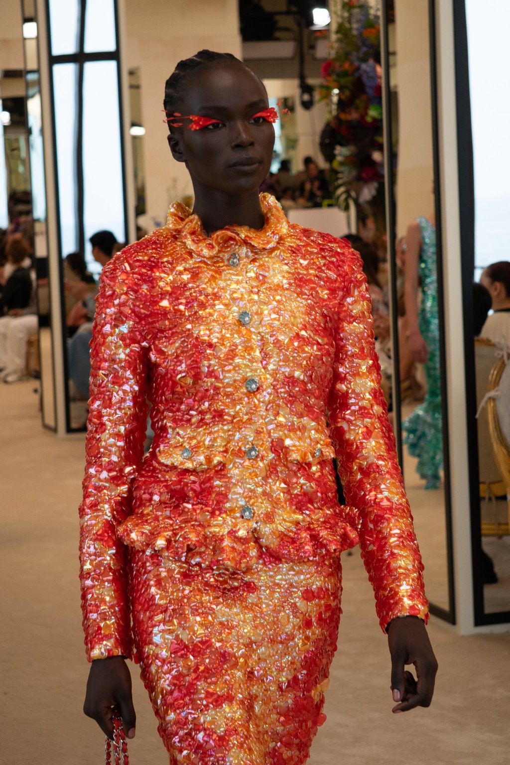 A fitted and fiery jacket with scallop-shaped buttons from Chanel cruise 2026-27. Photo: Handout