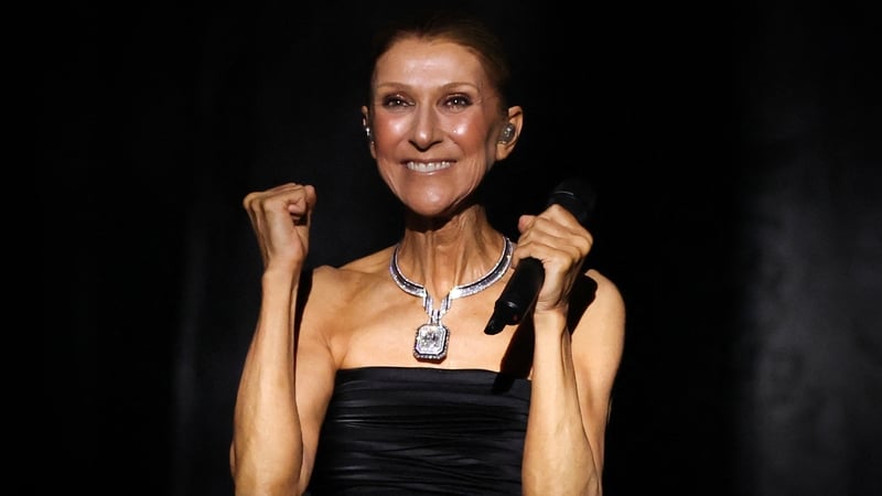 Canadian singer Céline Dion reacts as she appears on stage at the start of her first concert of a series at the Plenitude Arena in Nanterre, west of Paris on 12 September, 2026. (Photo by Thomas Samson/AFP)