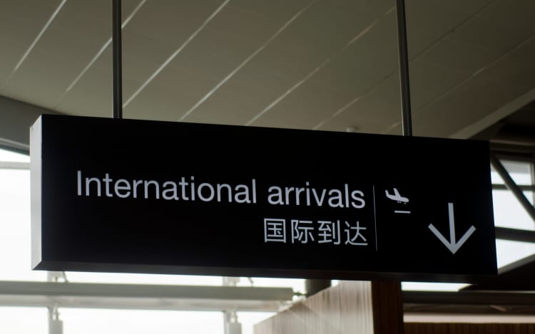 International arrivals airport sign