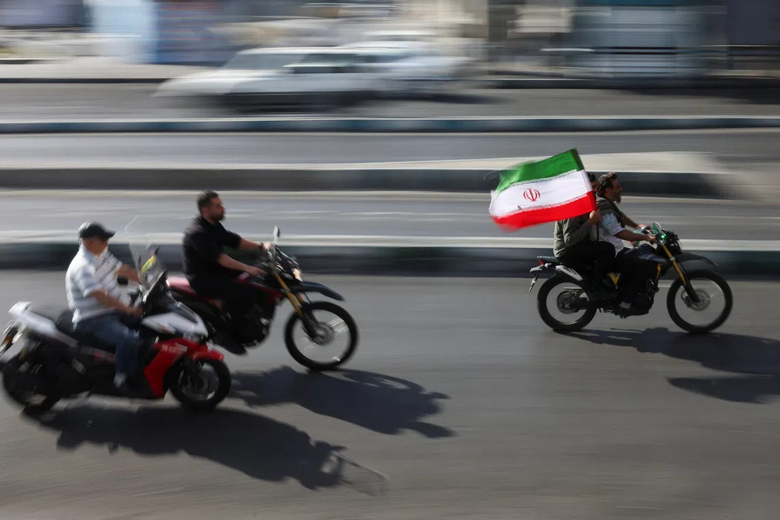 People ride on motorcycles as they participate in a march in Tehran, Iran, September 25, 2026. Majid Asgaripour/WANA (West Asia News Agency) via REUTERS