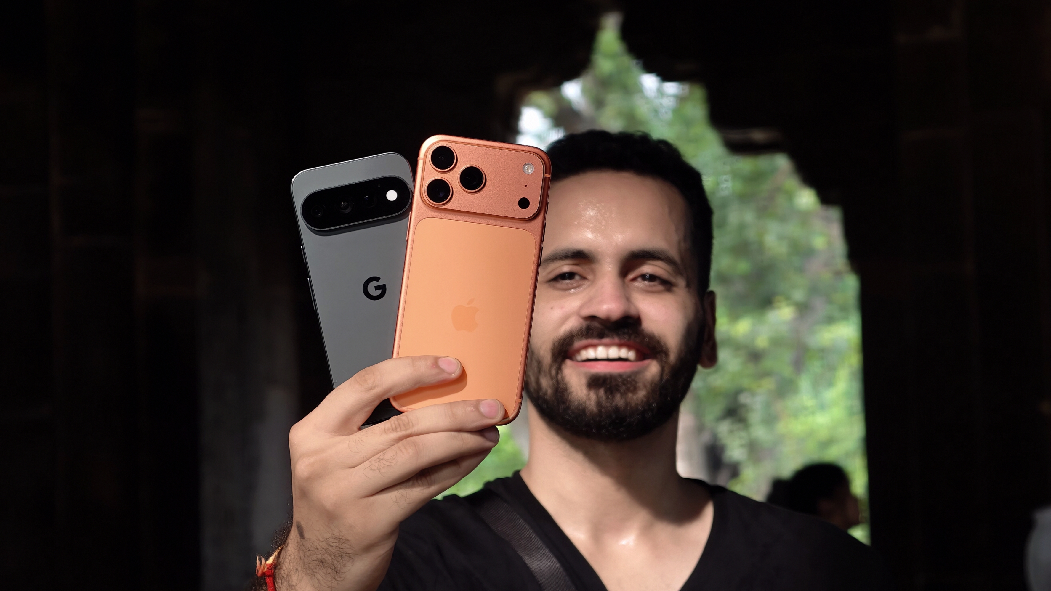 Prakhar Khanna holding Pixel 11 Pro and iPhone 17 Pro
