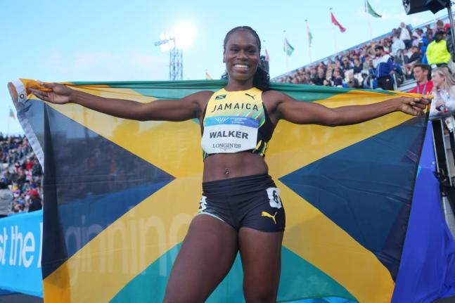 FILE Jamaica’s Sanique Walker celebrates after winning the women’s 400m hurdles final at the Commonwealth Games in Glasgow, Scotland.
