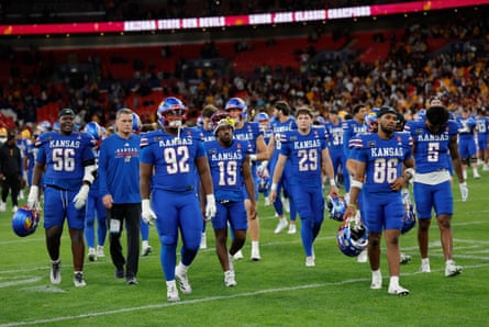 Dejected Kansas players walk off after the final whistle.