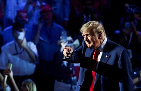 Trump on stage pointing.