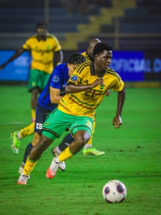 Teenager Jahmarie Nolan goes on a run during his Reggae Boyz debut against El Salvador on Friday night.